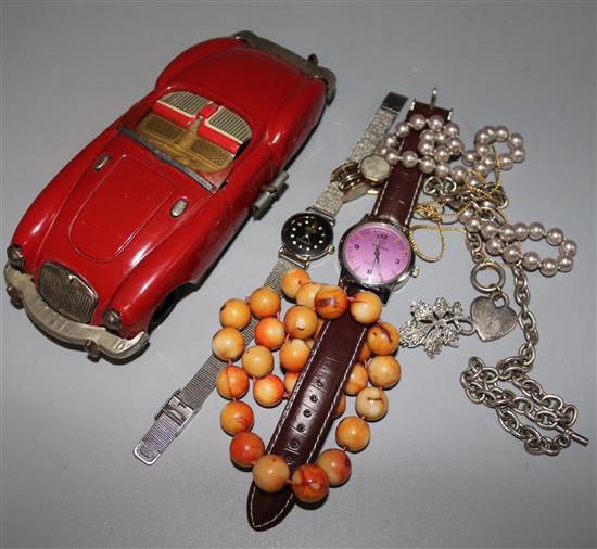 A Japanese tin plate car and jewellery